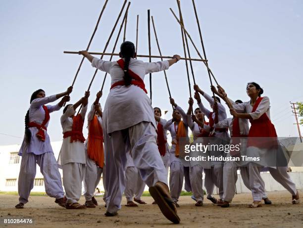 Hindu girls of the Durga Vahini, the 'saffron brigade' women's wing of the Hindu hardliner organization Vishwa Hindu Parishad , participate in a...