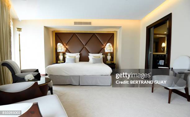 This photo taken on July 7, 2017 in Paris shows a deluxe room within the newly-renovated Le Fouquet's Hotel on the Champs-Elysees. / AFP PHOTO /...