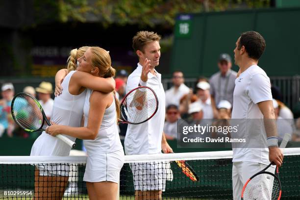 John Peers of Australia and Sabine Lisicki of Germany shake hands with Scott Lipsky of the United States and Alla Kudryavtseva of Russia after the...