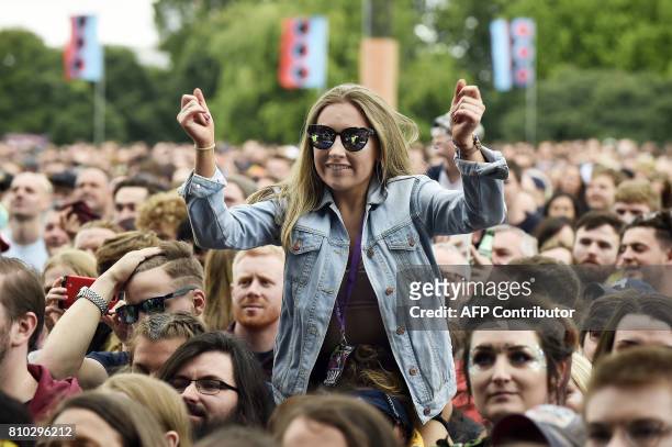 Music fans watch as Rag 'N' Bone Man performs on the main Stage at the TRNSMT music Festival on Glasgow Green, in Glasgow on July 7, 2017. / AFP...