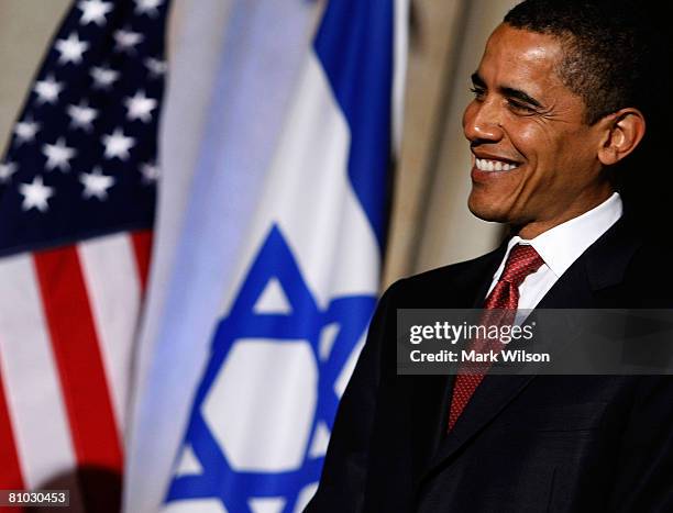 Democratic presidential hopeful Sen. Barack Obama listens to his introduction before speaking at an event to honor the 60th anniversary of Israel's...