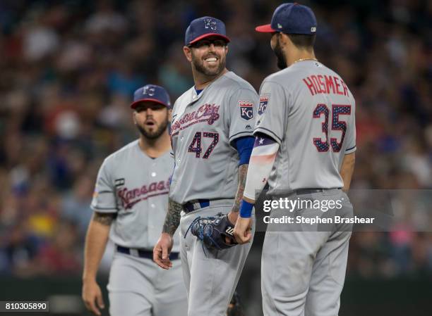From left, third baseman Mike Moustakas of the Kansas City Royals, relief pitcher Peter Moylan of the Kansas City Royals and first baseman Eric...