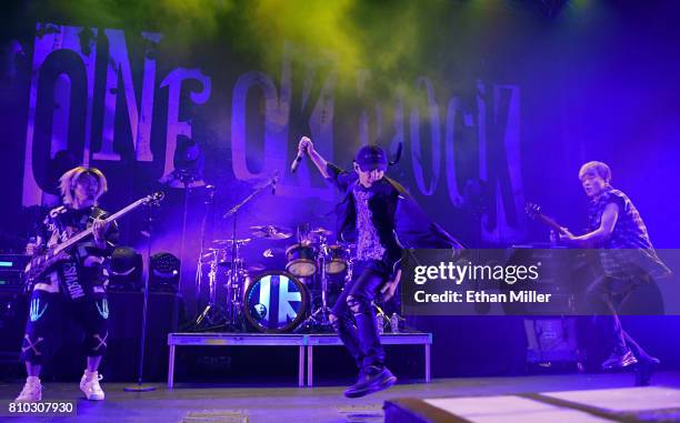 Bassist Ryota Kohama, drummer Tomoya Kanki, singer Takahiro "Taka" Moriuchi and guitarist Toru Yamashita of One OK Rock perform as the band kicks off...