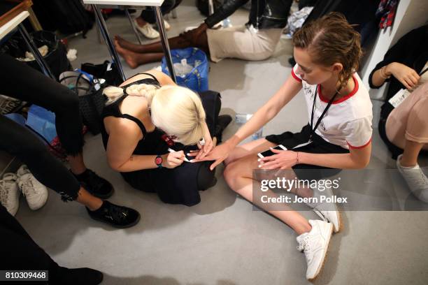 Model gets her nails painted backstage ahead of the Prabal Gurung show during the Mercedes-Benz Fashion Week Berlin Spring/Summer 2018 at Kaufhaus...