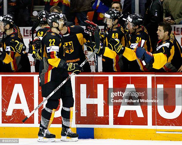 Michael Bakos of Germany celebrates his third period goal with team mates during the game against the United States at the IIHF World Ice Hockey...