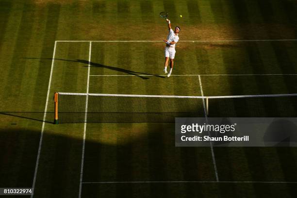 Fabio Fognini of Italy smashes the ball during the Gentlemen's Singles third round match against Andy Murray of Great Britain on day five of the...