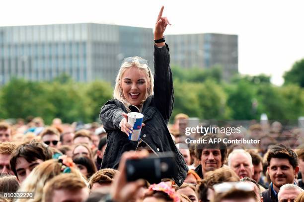 Music fans gather to listen as London Grammar performs on the main Stage at the TRNSMT music Festival on Glasgow Green, in Glasgow on July 7, 2017. /...