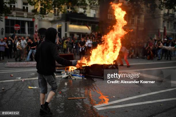 Left wing protesters burn barricades in the Schanze district during an anti-G20 march on July 7, 2017 in Hamburg, Germany. Authorities are braced for...