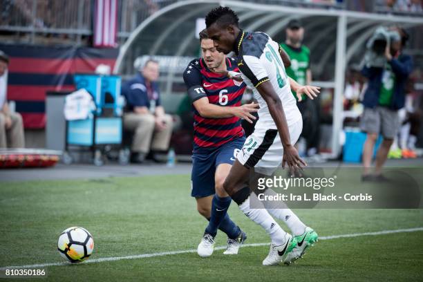 Kelyn Rowe of U.S. Men's National Team tries to keep the ball away from John Boye of the Ghana National Team during the International Friendly Match...