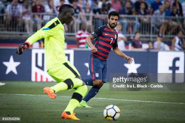 Kenny Saief of U.S. Men's National Team just checks to make sure that goalkeeper Richard Ofori of Ghana National Team clears the ball during the...