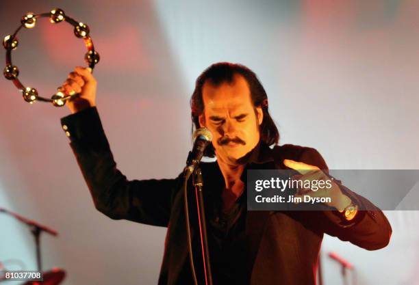 Australian musician Nick Cave performs with his band the Bad Seeds at the Hammersmith Apollo on May 8, 2008 in London, England.