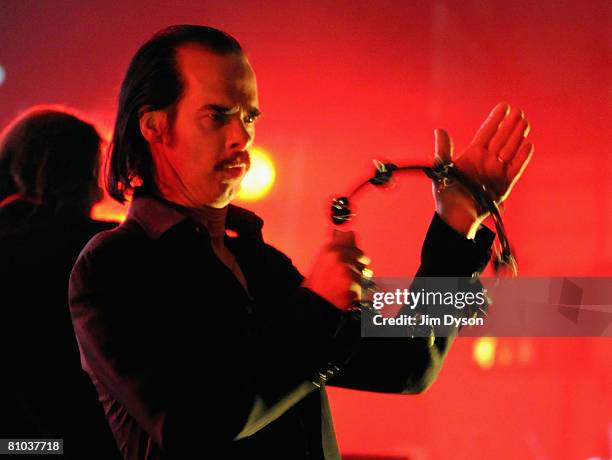 Australian musician Nick Cave performs with his band the Bad Seeds at the Hammersmith Apollo on May 8, 2008 in London, England.