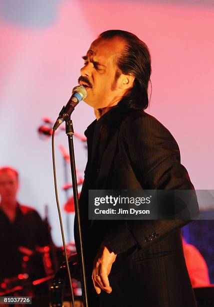 Australian musician Nick Cave performs with his band the Bad Seeds at the Hammersmith Apollo on May 8, 2008 in London, England.