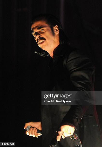 Australian musician Nick Cave performs with his band the Bad Seeds at the Hammersmith Apollo on May 8, 2008 in London, England.