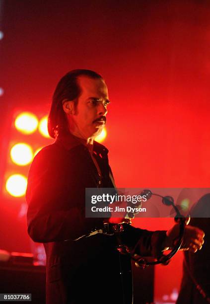 Australian musician Nick Cave performs with his band the Bad Seeds at the Hammersmith Apollo on May 8, 2008 in London, England.