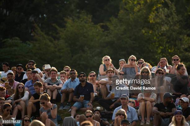 Spectators look on from 'Murray Mound' on day five of the Wimbledon Lawn Tennis Championships at the All England Lawn Tennis and Croquet Club on July...