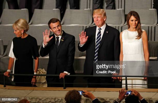 President Donald Trump , his wife Melania Trump , French President Emmanuel Macron and his wife Brigitte Macron attend a concert at the...