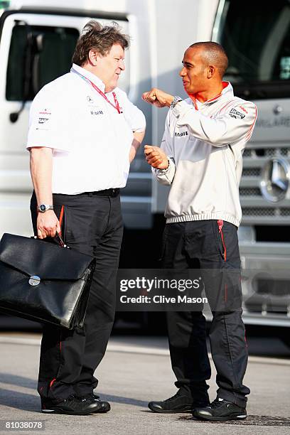 Vice President of Mercedes-Benz Motorsport Norbert Haug talks with Lewis Hamilton of Great Britain and McLaren Mercedes following practice for the...