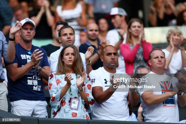 Davis Cup captain Leon Smith, Andy Murray's wife Kim Murray, physio Shane Annun and fitness trainer Matt Little applaud during the Gentlemen's...