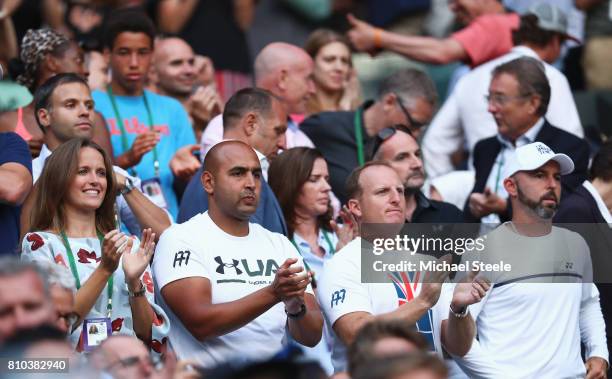 Andy Murray's wife Kim Murray, physio Shane Annun, fitness trainer Matt Little and coach Jamie Delgado applaud after the Gentlemen's Singles third...