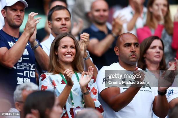 Davis Cup captain Leon Smith, Andy Murray's wife Kim Murray and physio Shane Annun applaud after the Gentlemen's Singles third round match between...