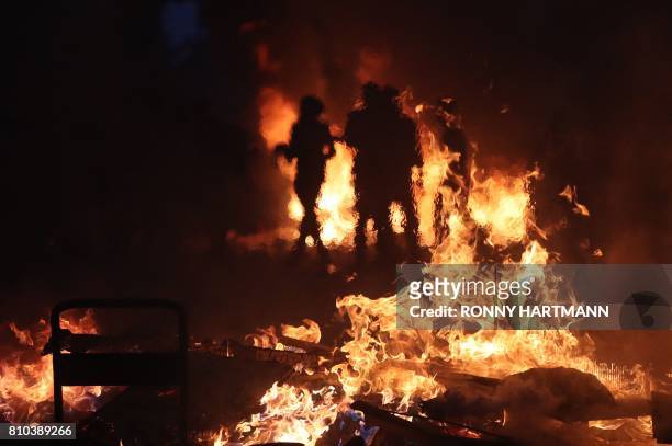 Protesters have set barricades alight on July 7, 2017 in Hamburg, northern Germany, where leaders of the world's top economies gather for a G20...