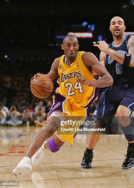 Kobe Bryant of the Los Angeles Lakers drives to the basket against Carlos Boozer of the Utah Jazz in Game Two of the Western Conference Semifinals...