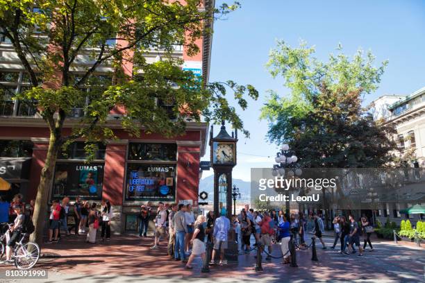 around steam clock at gastown,vancouver,canada - the blue man group in vancouver stock pictures, royalty-free photos & images