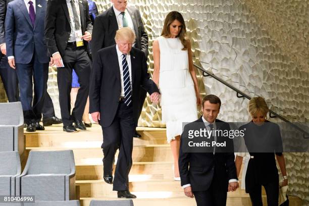 President Donald Trump and his wife Melania Trump, French President Emmanuel Macron and his wife Brigitte Macron attend a concert at the...