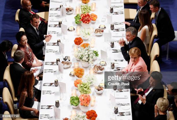 The leaders of the G20 Summit attend a state banquet in the Elbphilarmonie concert Hall on the first day of the G20 economic summit on July 7, 2017...