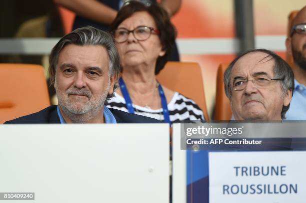 Late Montpellier's President Louis Nicollin's son, Laurent Nicollin and President of the French Football Federation Noel Le Graet look on during the...