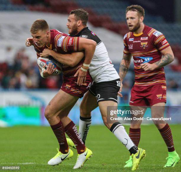 Huddersfield Giants's Alex Mellor is tackled by Widnes Vikings's Lloyd White during the Betfred Super League Round 21 match between Huddersfield and...