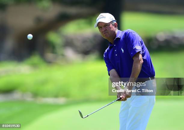 Davis Love III plays a shot on the 15th hole during round two of The Greenbrier Classic held at the Old White TPC on July 7, 2017 in White Sulphur...