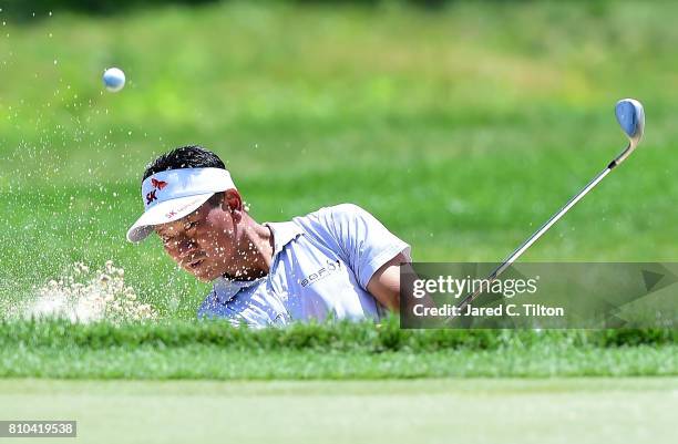 Choi chips out of the sand on the 15th hole during round two of The Greenbrier Classic held at the Old White TPC on July 7, 2017 in White Sulphur...