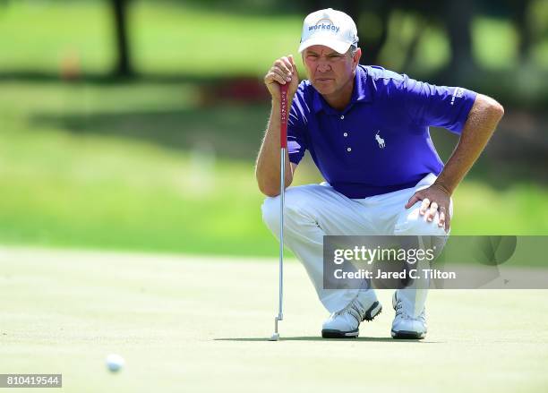 Davis Love III lines up his par putt on the 15th green during round two of The Greenbrier Classic held at the Old White TPC on July 7, 2017 in White...