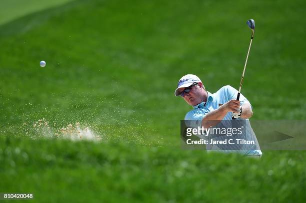 Brad Fritsch of Canada chips out of the sand on the 15th hole during round two of The Greenbrier Classic held at the Old White TPC on July 7, 2017 in...