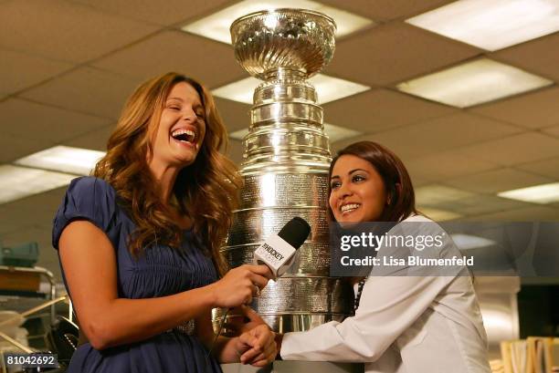 Heidi Androl of "The Hockey Show" interviews actress Parminder Nagra with the Stanley Cup on the set of "E.R" at Warner Bros. Studios on May 9, 2008...