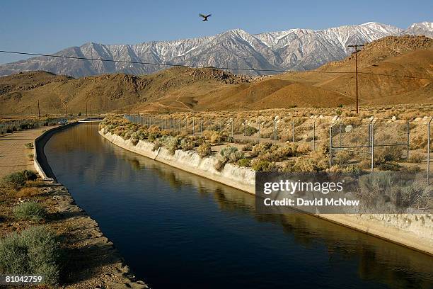 The Los Angeles Aqueduct carries water from the snowcapped Sierra Nevada Mountains, which carry less snow than normal, to major urban areas of...