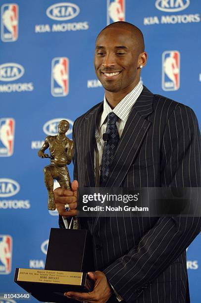 Kobe Bryant of the Los Angeles Lakers poses with the MVP award during the 2007-08 NBA Most Valuable Player Award press conference presented by Kia...