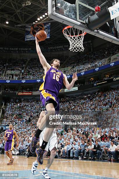 Pau Gasol of the Los Angeles Lakers dunks the ball in front of Andrei Kirilenko of the Utah Jazz in Game Three of the Western Conference Semifinals...