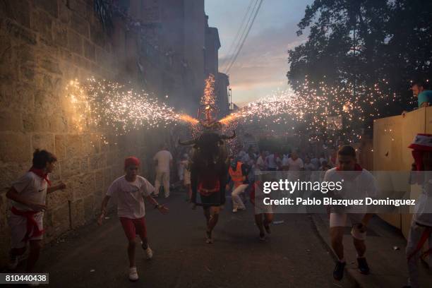 Toro del Fuego is run through the streets of Pamplona during the second day of the San Fermin Running of the Bulls festival on July 7, 2017 in...