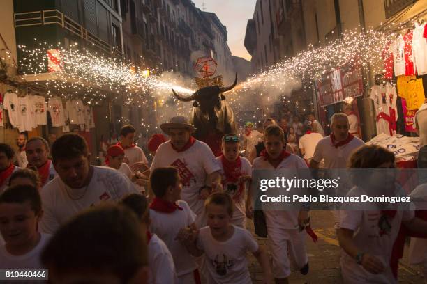 Toro del Fuego is run through the streets of Pamplona during the second day of the San Fermin Running of the Bulls festival on July 7, 2017 in...
