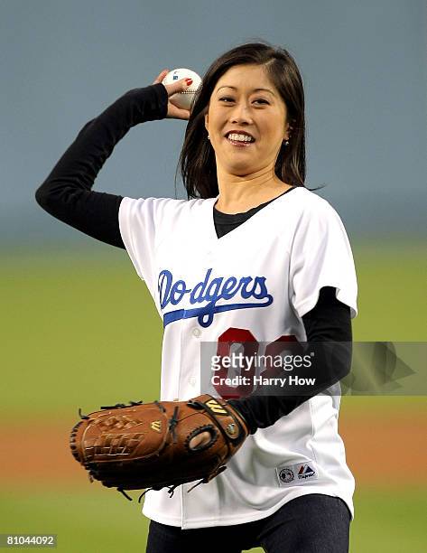 Kristi Yamaguchi throws out the ceremonial first pitch before the game between the Los Angeles Dodgers and the Houston Astros at Dodger Stadium on...