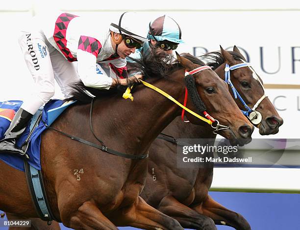 Gold In Dubai ridden by Michael Rodd narrowly wins Race Four the Bayside Chrysler Jeep & Didge Blue Sapphire Stakes during the Thoroughbred Club Cup...