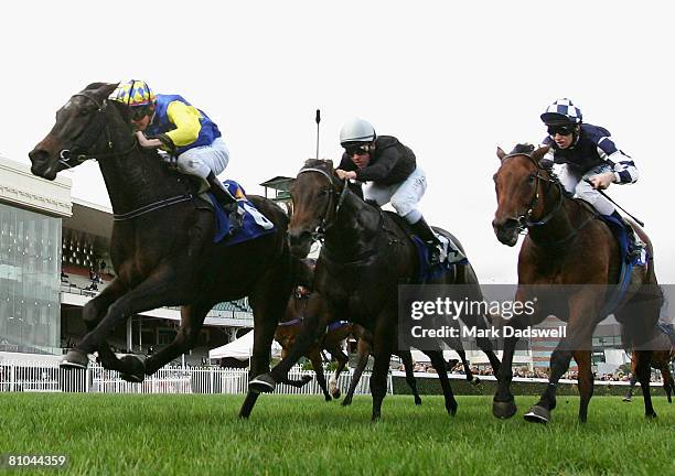 Sebastian Murphy riding Beaming on the outside wins Race Five the L U Simon Builders Plate during the Thoroughbred Club Cup Day meeting at Caulfield...