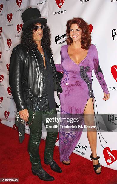 Recording artist Slash and his guest attend the fourth annual MusiCares Benefit Concert at The Music Box @ Fonda on May 9, 2008 in Hollywood,...