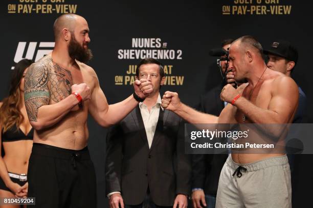 Opponents Travis Browne and Aleksei Oleinik of Russia face off during the UFC weigh-in at the Park Theater on July 7, 2017 in Las Vegas, Nevada.