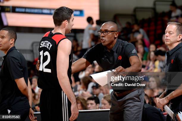 Patrick Mutombo of the Toronto Raptors talks with Will Sheehey of the Toronto Raptors during the game against the New Orleans Pelicans during the...