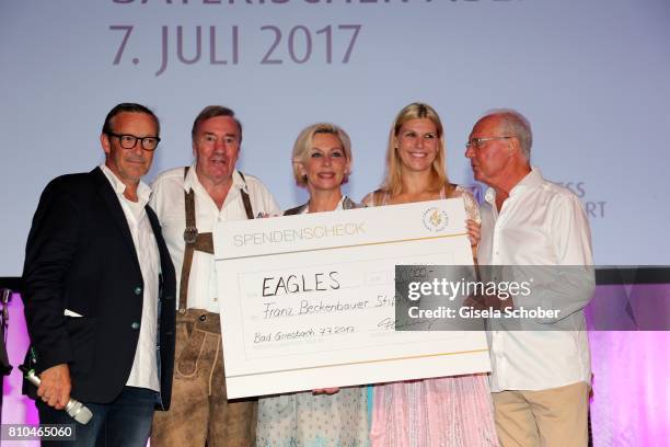 Michael Roll, Frank Fleschenberg, Claudia Jung, Anke Huber and Franz Beckenbauer with a cheque during a bavarian evening ahead of the Kaiser Cup 2017...