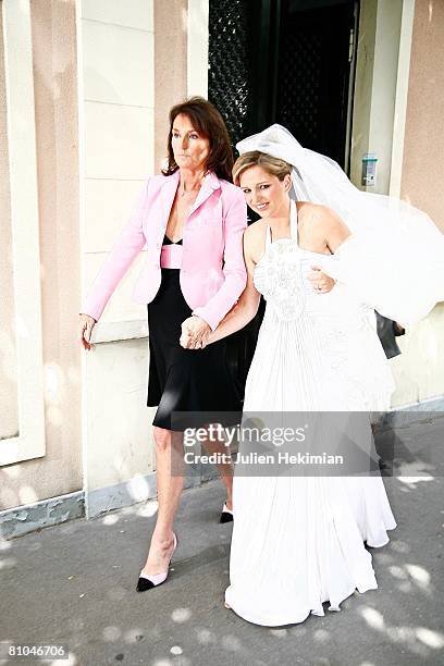 Cecilia Attias and her daughter Jeanne-Marie Martin leave Richard Attias' house to go to the St Pierre de Neuilly church on May 10, 2008 in Paris,...
